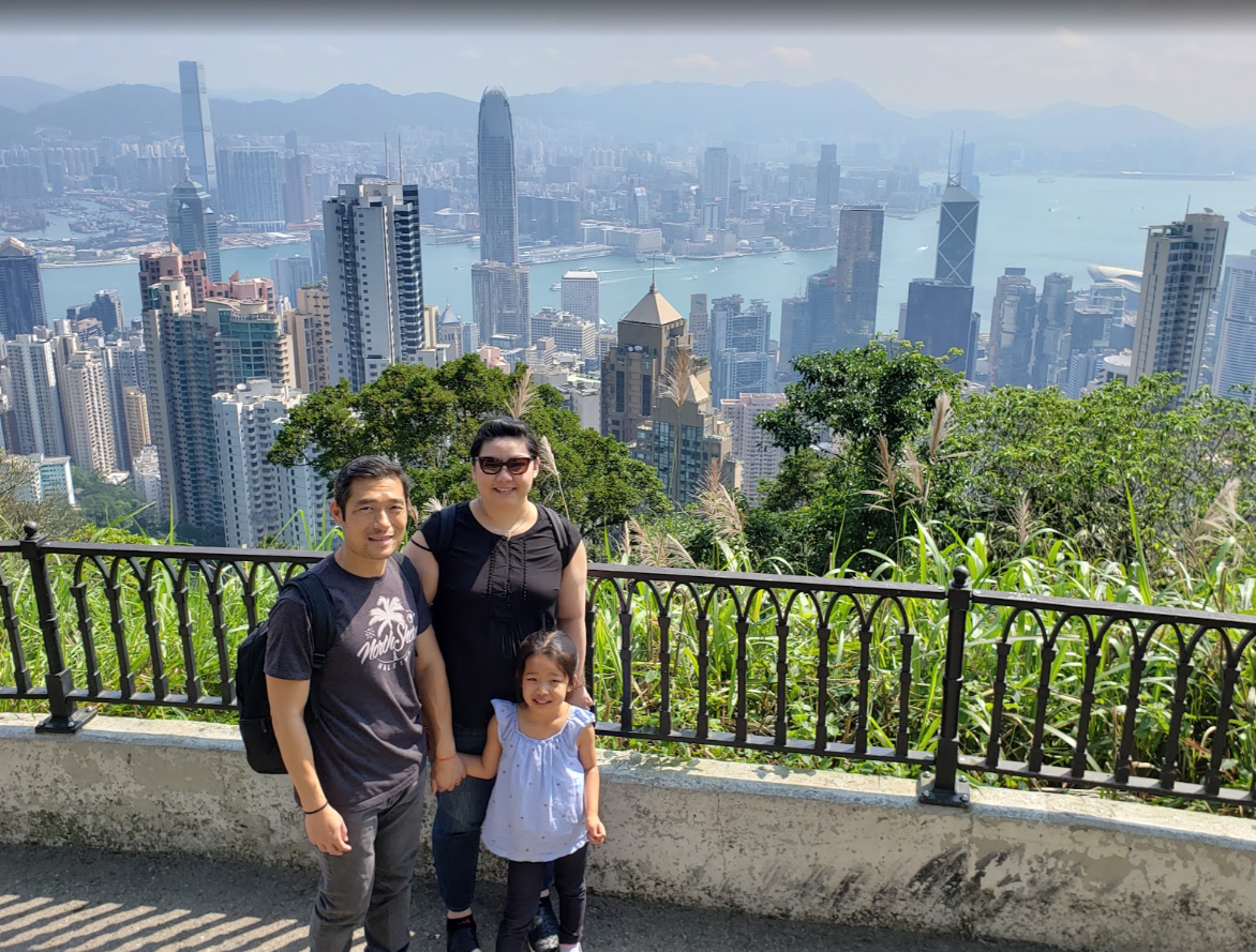A family photo overlooking Hong Kong and Victoria Harbour