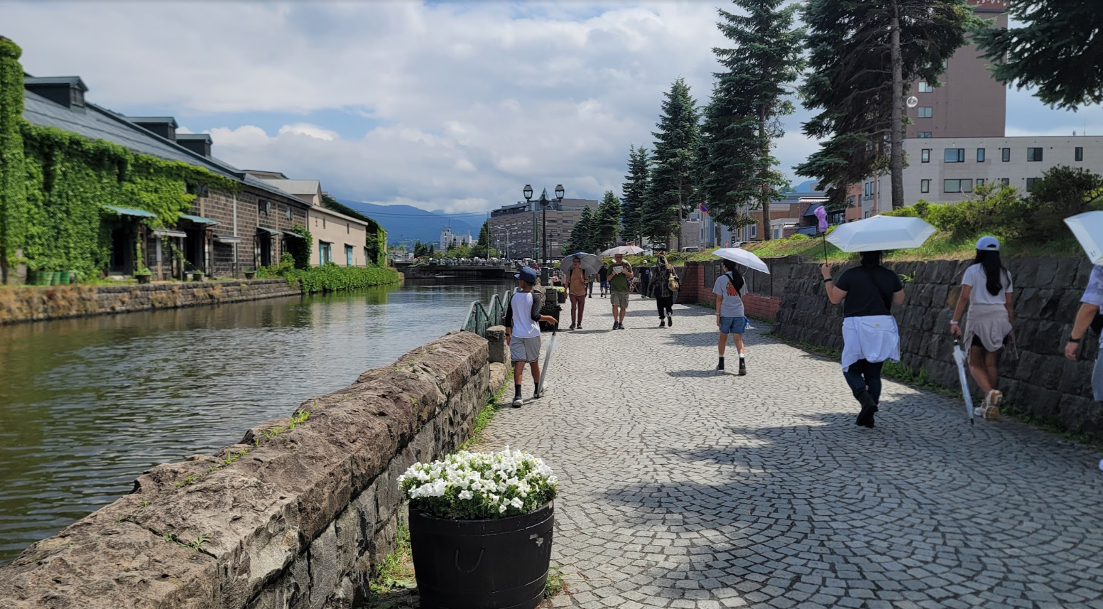 A walk beside a canal and ivy-covered buildings in Japan